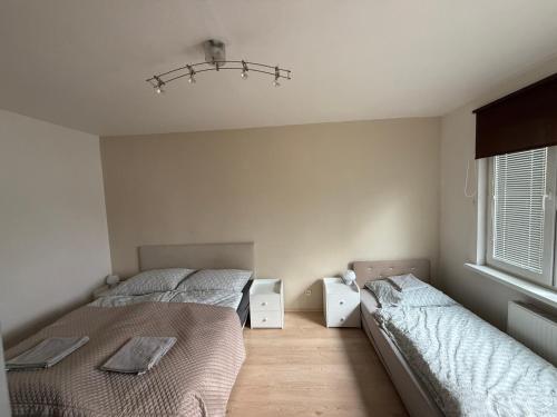 Postel nebo postele na pokoji v ubytování Apartmán Nela