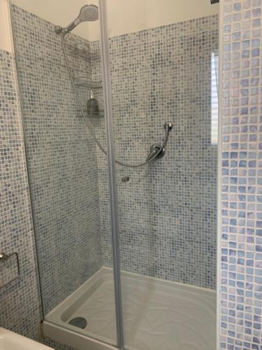 a shower with a glass door in a bathroom at La Terrazza in San Giovanni Valdarno