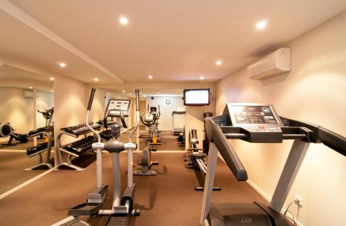 a gym with treadmills and elliptical machines at Copthorne Hotel & Apartments Queenstown Lakeview in Queenstown