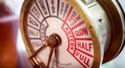 a close up of a clock with the words slow and half run at Home Hotel With in Tromsø