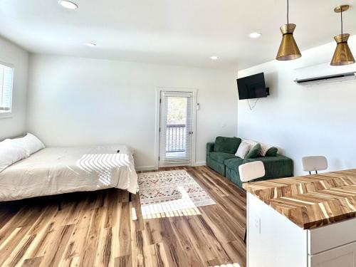 a living room with a bed and a couch at Glacier Alpine Escape in East Glacier Park