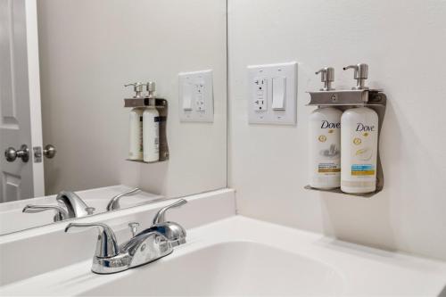 a bathroom with a sink and a mirror at The Pine House in Davidson