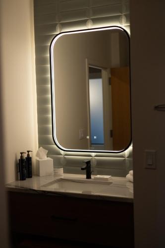 a bathroom with a mirror and a sink in a room at Little Creek Casino Resort in Kamilche