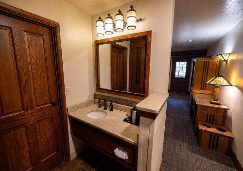 a bathroom with a sink and a mirror at Zion Lodge - Inside the Park in Springdale