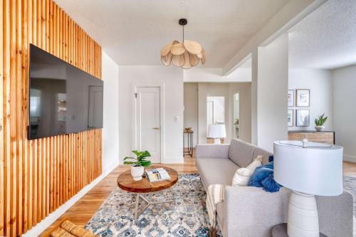 a living room with a couch and a table at Stay Portland - Spacious Studio in Brooklyn in Portland