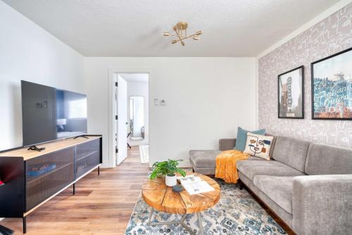 a living room with a couch and a table at Stay Portland - Brilliant Brooklyn 1 Bedroom Apt in Portland