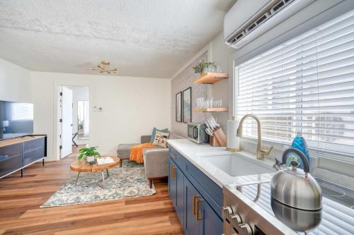 a kitchen with a sink and a living room at Stay Portland - Brilliant Brooklyn 1 Bedroom Apt in Portland
