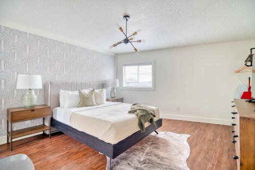 a bedroom with a bed and a chandelier at Stay Portland - Super Studio in Brooklyn in Portland