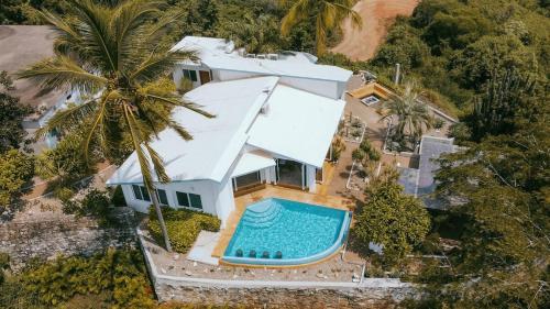 an overhead view of a house with a swimming pool at Casa Cumbres - Ocean View in Puerto Escondido