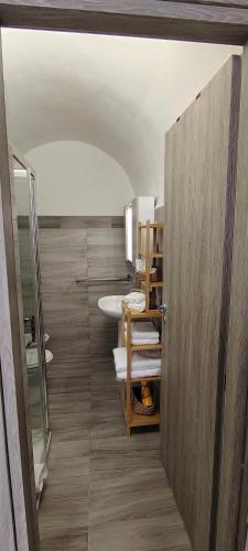 a bathroom with a sink and a mirror at Raggiu di Suli in Noto