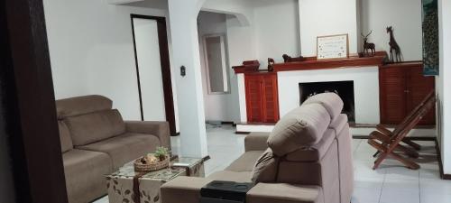 a living room with a couch and a fireplace at Rivera, céntrico , moderno y luminoso ,con 2 dormitorios in Rivera