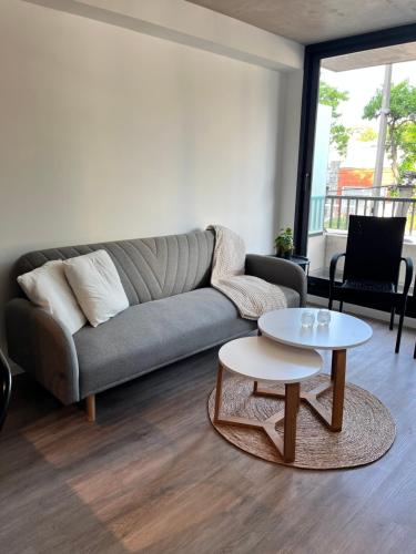 a living room with a couch and a table at Link in Montevideo