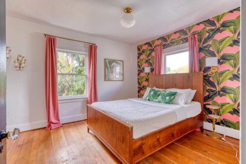 a bedroom with a wooden bed in a room at Stay Portland - Lively 2BR Old Hollywood Apt - 92 WalkScore in Marquam Hill