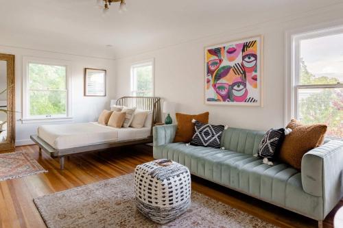a living room with a couch and a table at Stay Portland - BoHo Oasis in Ladd's Addition with 2 Beds in Portland