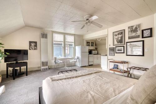 a large bedroom with a bed and a ceiling fan at Stay Portland - Sun-Filled Buckman Studio! in Portland