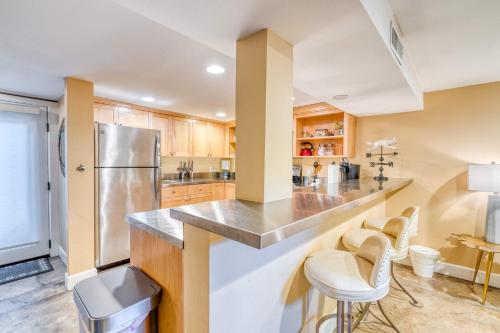 a kitchen with a counter and a refrigerator at Stay Portland - Private Underground Getaway - 92 WalkScore in Portland