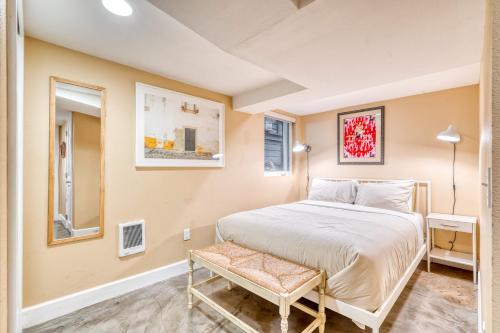 a bedroom with a bed and a chair in it at Stay Portland - Private Underground Getaway - 92 WalkScore in Portland