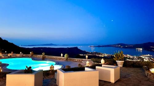a view of a swimming pool at night at Villa Ventu di Mari, vista mozzafiato su Caprera e sulle Isole, Piscina Riscaldata in Costa Smeralda in Cannigione