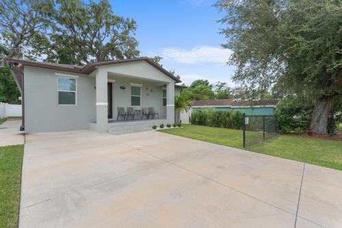 a house with a driveway in front of it at Busch Garden New House in Tampa
