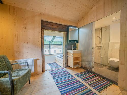 a bathroom with a sink and a toilet in a room at Raneburg 4 Almhaus in Matrei in Osttirol