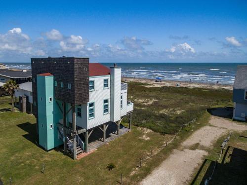 an aerial view of a house and the beach at Beachfront Melody in Galveston