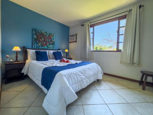 En eller flere senge i et værelse på EstrelaMar Ferradura Restaurante & Spa