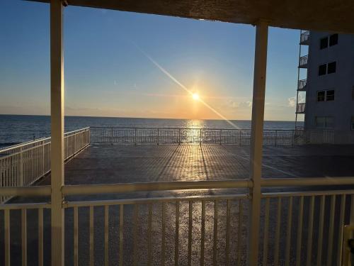 a view of the ocean from the porch of a beach house at Beachfront Condo, Ocean Views, Near Patrick SFB in Satellite Beach
