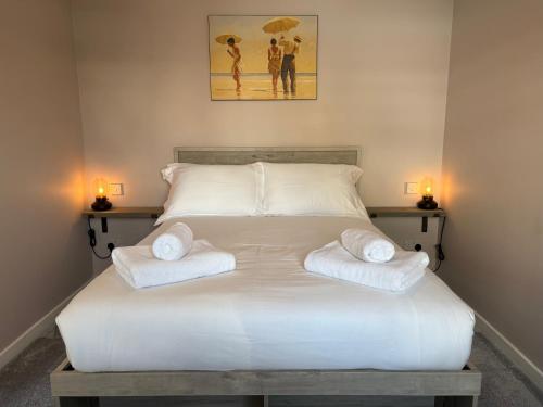 Ένα ή περισσότερα κρεβάτια σε δωμάτιο στο Pan Ha Cottage