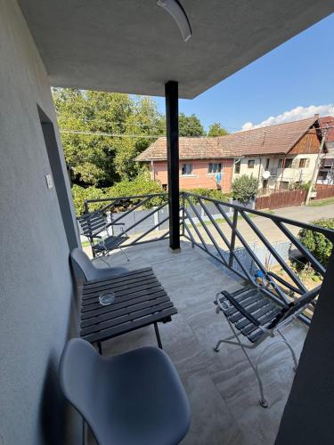 a view of a balcony with a bench and stairs at Bee house 12 in Odorheiu Secuiesc