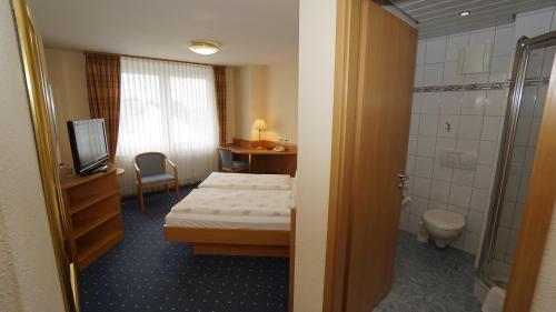 Posteľ alebo postele v izbe v ubytovaní Hotel Anika