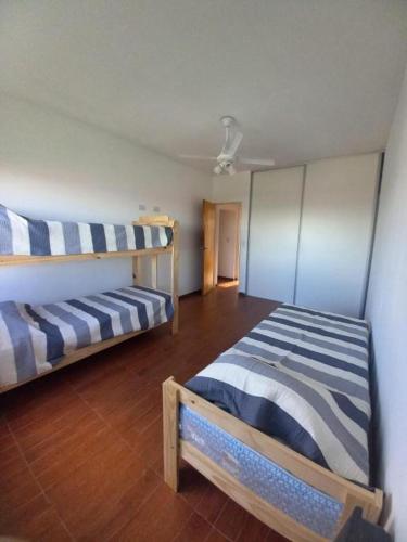 a bedroom with two bunk beds in a room at Paz en Funes in Funes
