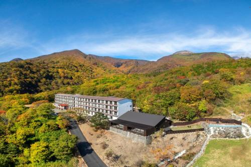 an aerial view of a building in the mountains at YU-FURI Nasu-Takao Onsen Lodge in Nasu