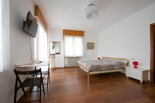 A bed or beds in a room at Marzola