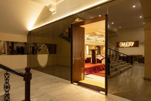 a entrance to a store with a bobby sign on the wall at Jenneys Residency in Coimbatore