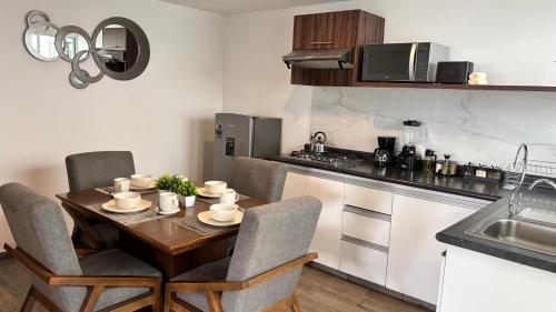 Η κουζίνα ή μικρή κουζίνα στο Bonito Departamento en Metepec