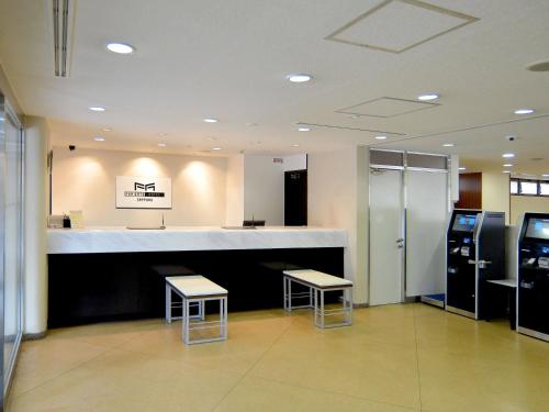 Kuchyň nebo kuchyňský kout v ubytování FUN GATE HOTEL Sapporo