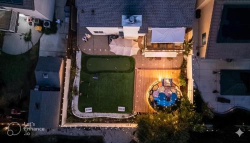 an overhead view of a backyard with a pool and a house at Elegant Retreat- Sleep 10-Boho Dome Lounge-Hot Tub-Games-Golf-Serene Getaway in Sacramento