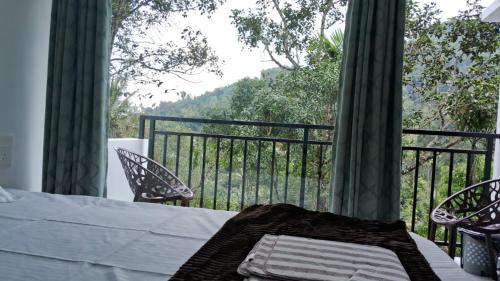 En balkon eller terrasse på The Lovely Home Stay