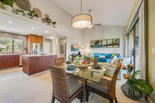 a dining room and living room with a table at Wailea Ekahi 40E · WEK 40E Dream Getaway w AC Pools Beaches Golf in Wailea