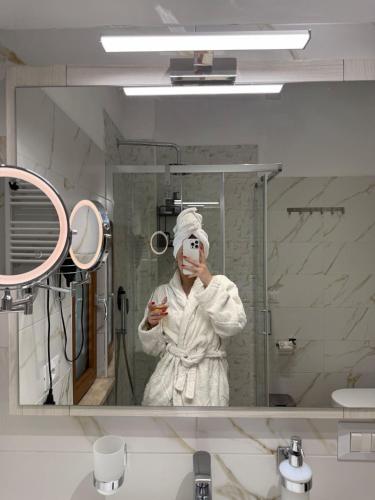 a person in a mirror in a bathroom at Chalet n5- Ombrellone GRATIS incluso a Catanzaro Lido- in Catanzaro