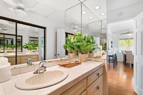a bathroom with a sink and a large mirror at Kaanapali Plantation 10 · KPL 10 Panoramic Ocean Views 2BD near in Lahaina