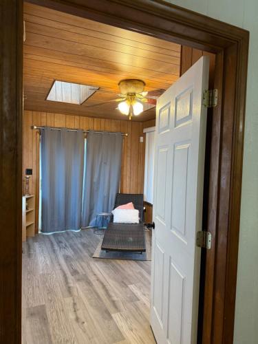 an open door to a room with a bed in it at Master Bedroom with Attached SunRoom and Attached Patio in Richmond