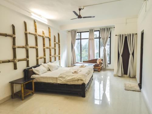 a bedroom with a large bed in a room at Dzukou Lodge in Kohīma