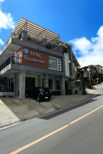 a car parked in front of a building at TPRC Residences in Baguio