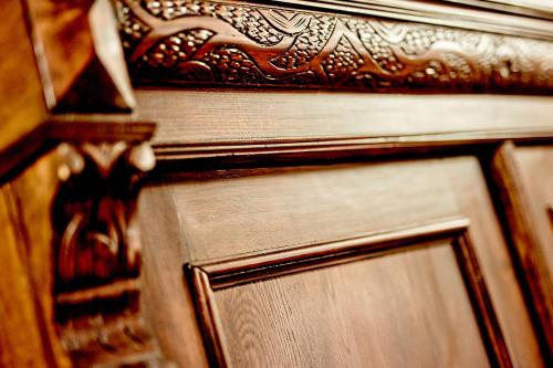 a close up of a wooden door with an ornate design at Pałac Bażantarnia in Pszczyna