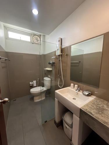 a bathroom with a sink and a shower and a toilet at B House Chiang Mai Thailand in Chiang Mai