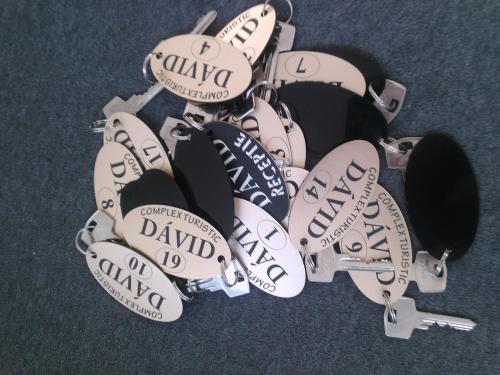 a bunch of baseball pins with the names on them at Complex Turistic Dávid in Boghiş