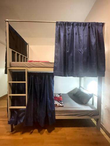 a bunk bed in a room with a window at Skybar Koh Rong in Koh Rong