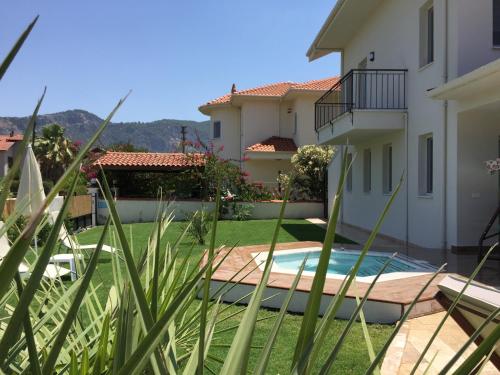 a view of the backyard of a house at Crescent Twins -White Villa in Dalyan