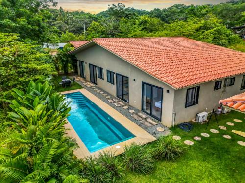 an aerial view of a house with a swimming pool at Casa Ola - Tropical Beachside Escape in Playa Venao